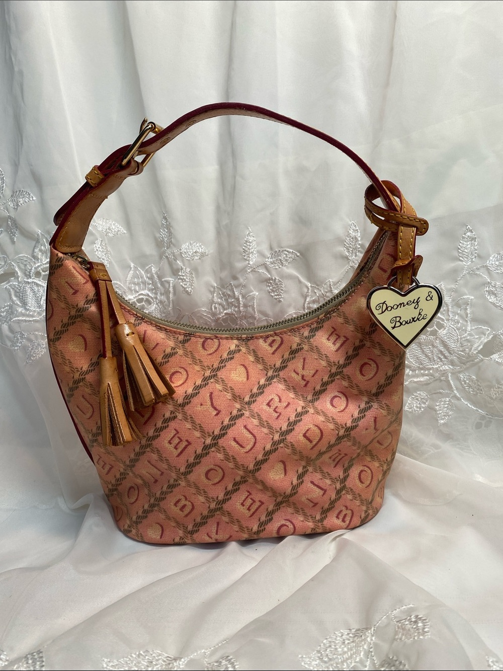 Dooney & Bourke Coral Pink Logo Shoulder Hobo Bucket Bag with Tassel Charm
